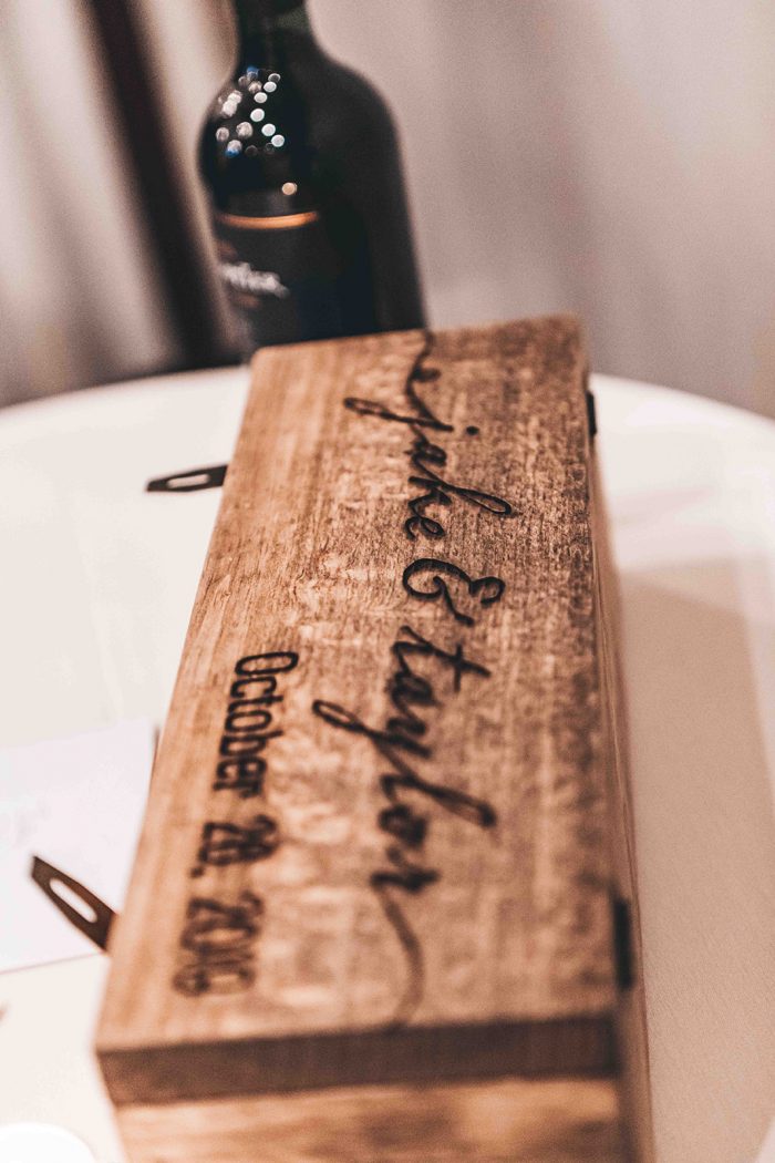 Bride and Grooms names engraved onto the lid of a wooden wine box